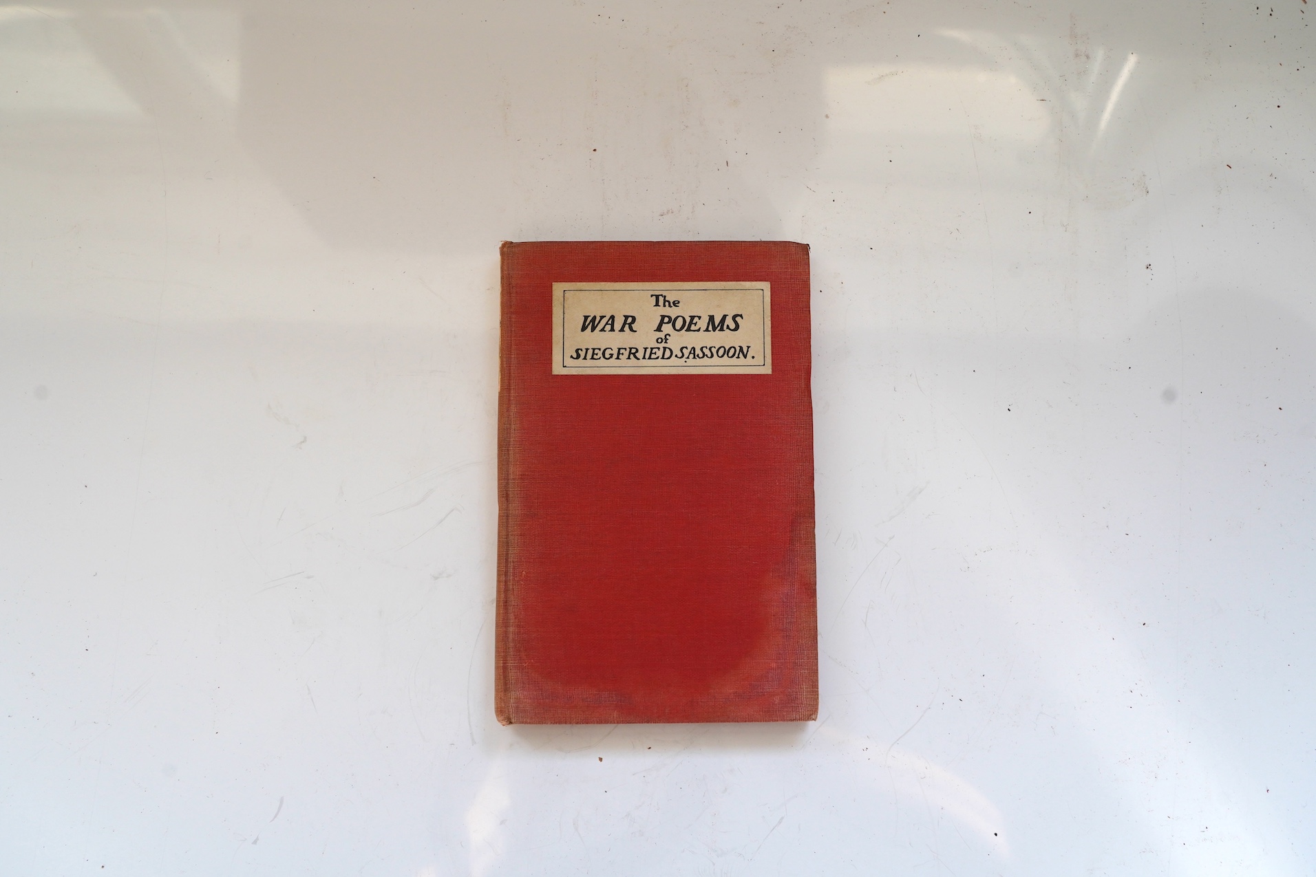 Sassoon, Siegfried - The War Poems. First Edition. half title; publisher's red cloth, with cover and spine printed labels, sm. 8vo. William Heinemann, 1919